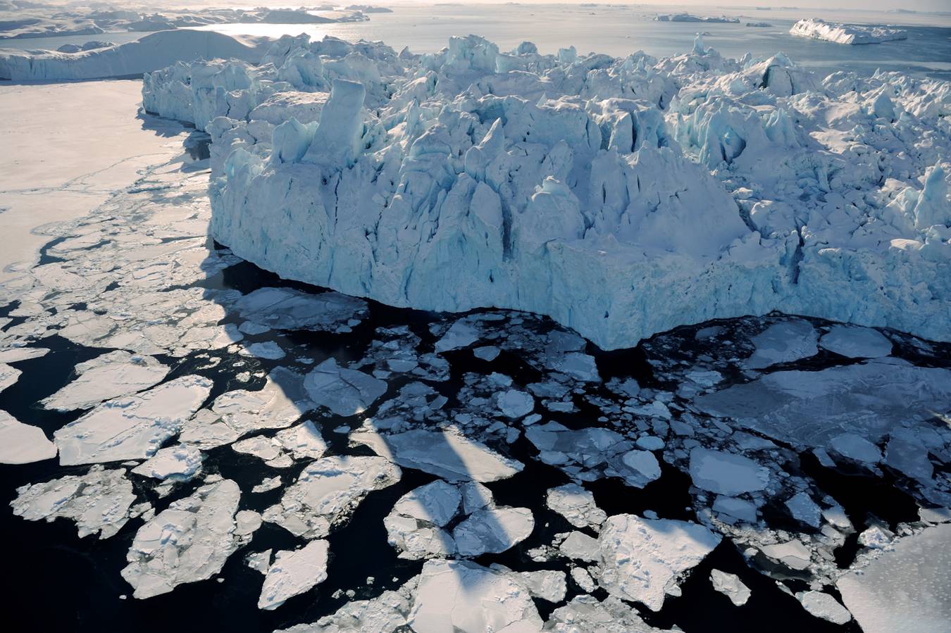 James Balog, Bay, Greenland, 15 March 2008. A massive chunk of the Ilulissat Glacier floats out to sea. Photograph Copyright 2014 James Balog/Extreme Ice Survey Courtesy of the artist