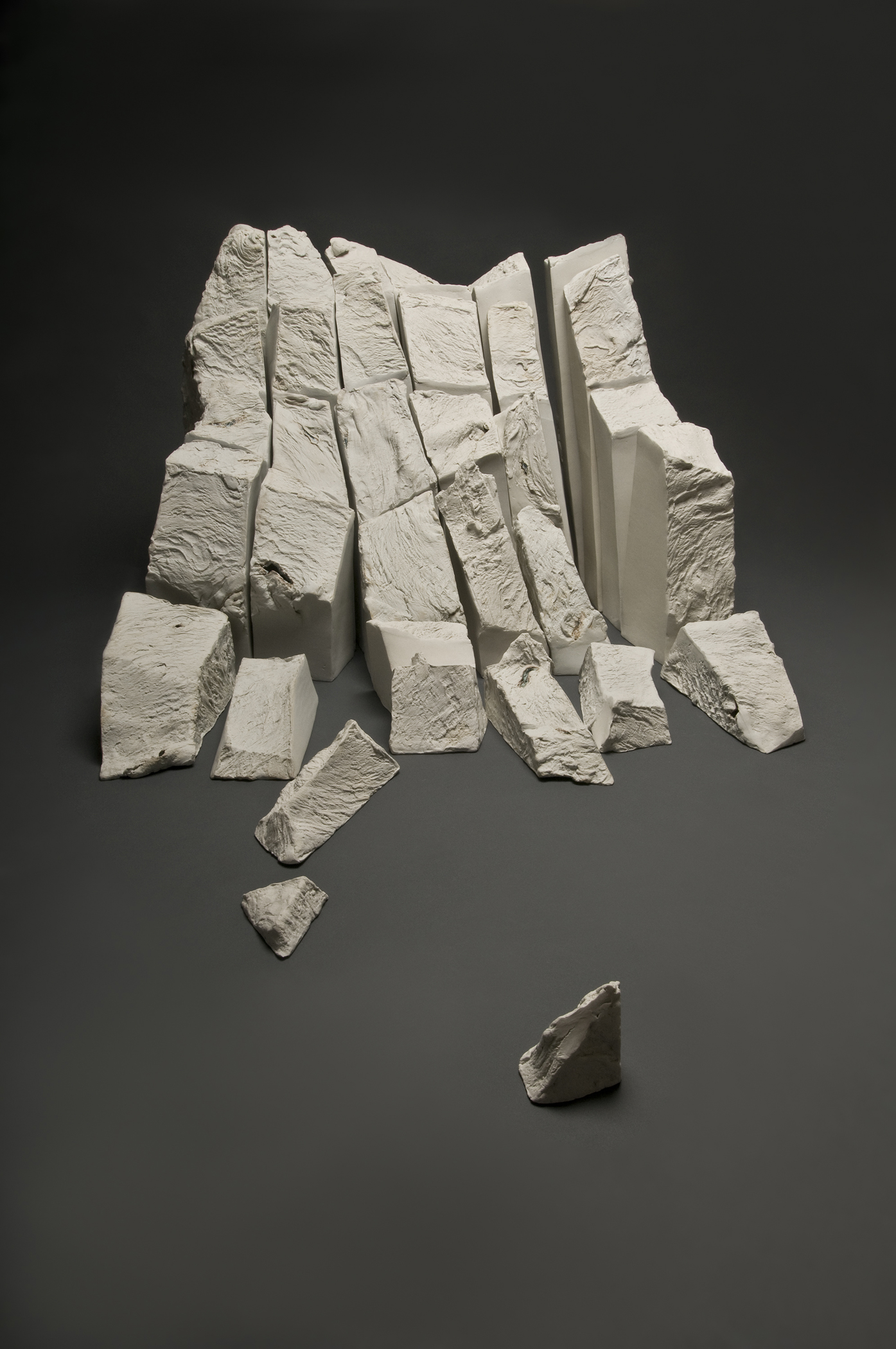 Paula Winokur, <i>Calving Gracier</i> (2010). 33 Porcelain sections. Dimensions: 6’ w X 8’ d (base), variable heights to 36”. Collection: Racine Art Museum, Wisconsin. ©Paula Winokur 2010. Courtesy of the artist.
