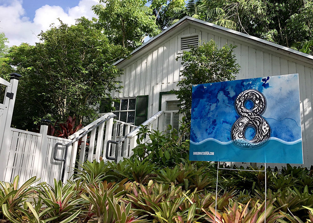 Xavier Cortada, Underwater Home Owners Association (2018). Photo of a marker installed in front of a Pinecrest Village home. ©Cortada, 2018. Courtesy of the artist.
