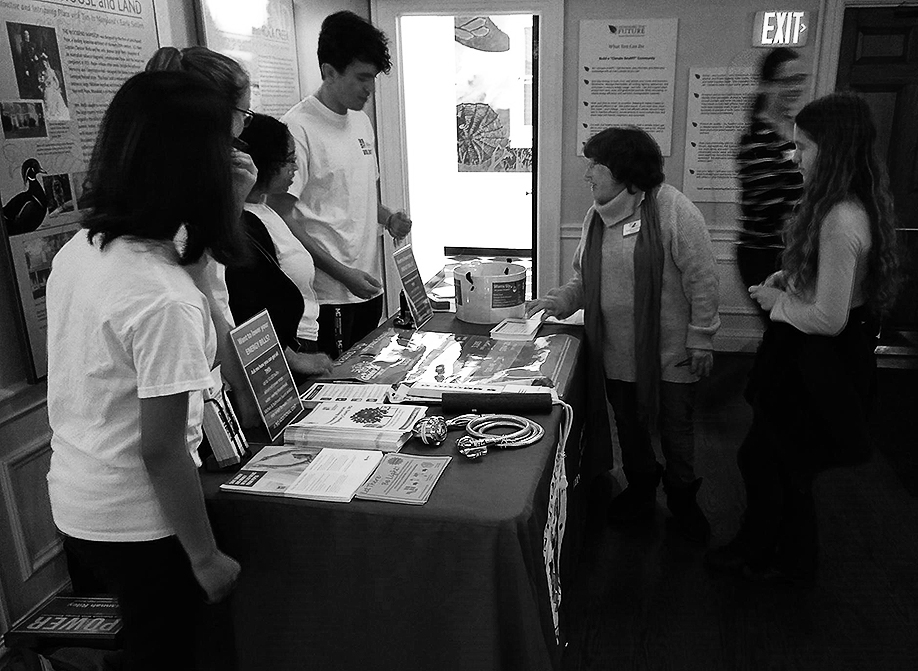 Exhibition visitors learn energy efficiency tips from high school volunteers in ANS’s P.O.W.E.R. (Peer Outreach With Energy Resources) program. 
