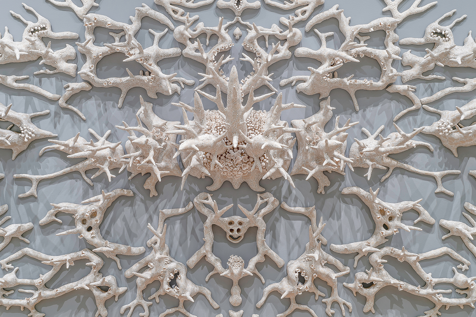Courtney Mattison, <i>Malum Geminos</i> (“Evil Twins” in Latin)(detail)(2019). Glazed stoneware and porcelain. Dimensions: 7’ x 21’ x 2’. Photograph by Paul Mutino for the Florence Griswold Museum. ©2019 Courtney Mattison. Courtesy of the artist. On exhibit at the Florence Griswold Museum.