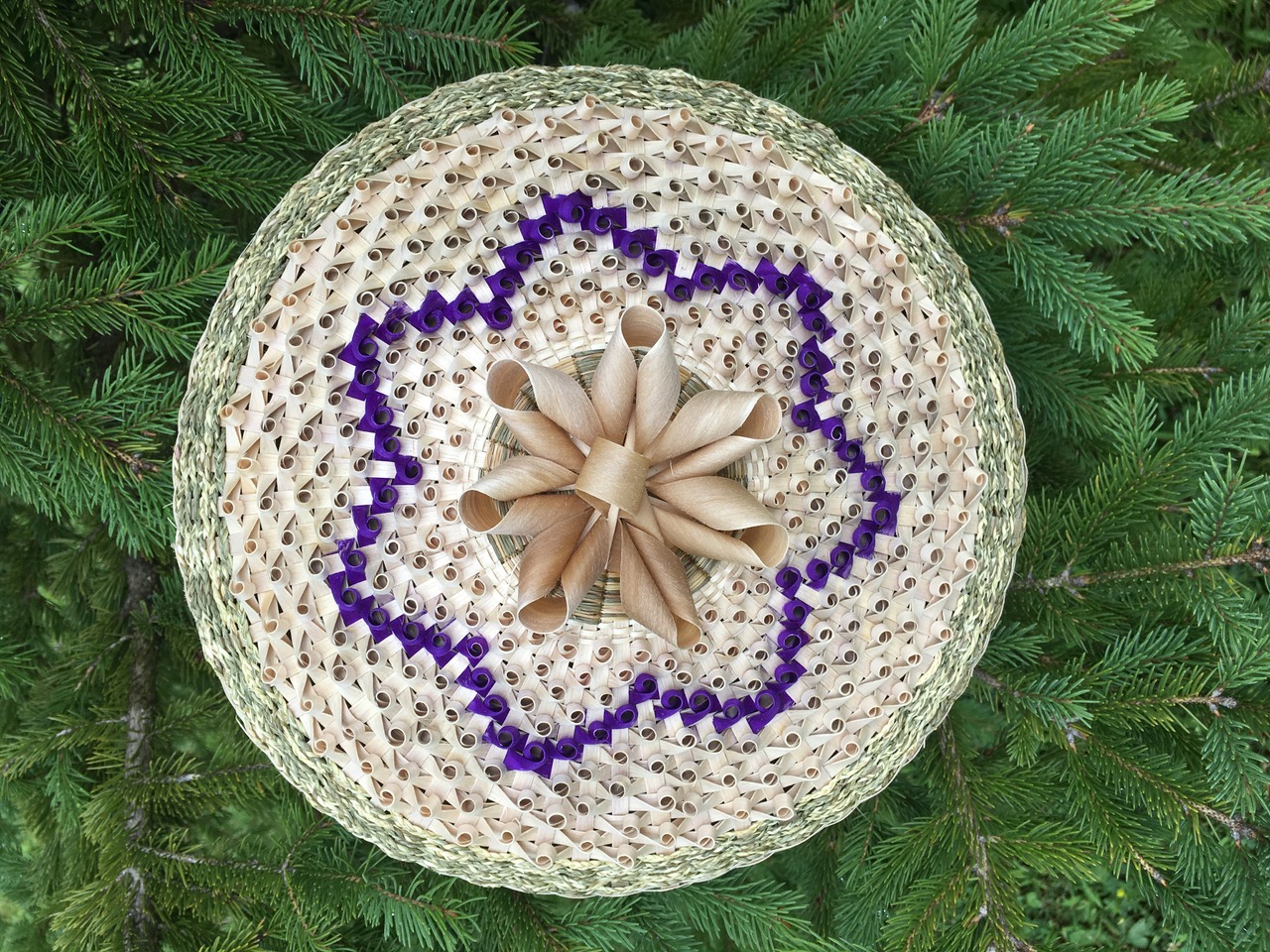 Sheila Ransom, Basket given to Pope Benedict XVI upon the canonization of Mohawk Kateri Tekakwitha (2012). Black ash and sweetgrass. ©Sheila Ransom, 2012. Courtesy of the artist. Basketmaking is a cherished Akwesasne Mohawk skill, passed from generation to generation to give thanks for creation and celebrate tribal values. Today, black ash trees for basketmaking are scarce – victims of pollution, overharvesting, and habitat destruction. Climate warming favors a new menace: the tree-devouring emerald ash borer. The resilient Akwesasne are saving seeds to regenerate ash stands as they search for alternative raw materials. Ransom explains: “Because it takes 40-50 years for ash trees to grow to a good size, only future generations will see the fruits of our labor. We persevere because it is our responsibility to preserve this gift of creation for future generations.”