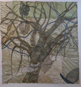 Nancy Cohen, Settling In (2019). Paper pulp, ink and handmade paper. Dimensions: 77 x 73 inches. ©Nancy Cohen 2019. Courtesy of the artist. The day Cohen settled into a studio in a neglected residential area, she found a welcome surprise. Some kind soul had removed a dilapidated building in the adjacent lot, revealing a view of a majestic, 7-story high tree outside her window. Marveling at the pollution and neglect the tree must have endured to survive, Cohen created Settling In to pay homage to the tree’s resilience and to remind us to notice and treasure nature’s wonders in our midst.