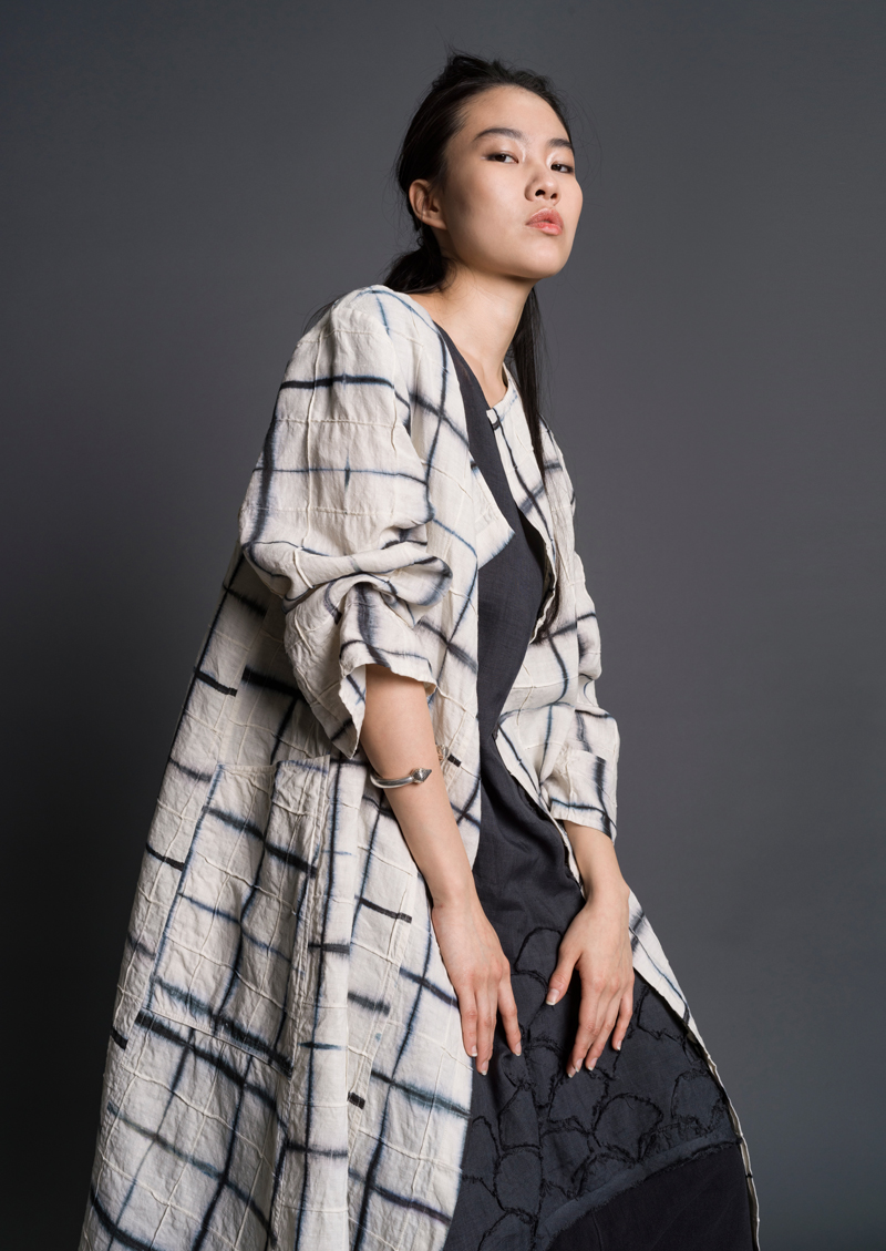 Amy Nguyen, Artisan Coat. Hand-dyed itajime shibori linen, overdyed, folded, stitched, pieced. ©2021 Amy Nguyen Textiles. Courtesy of the artist.