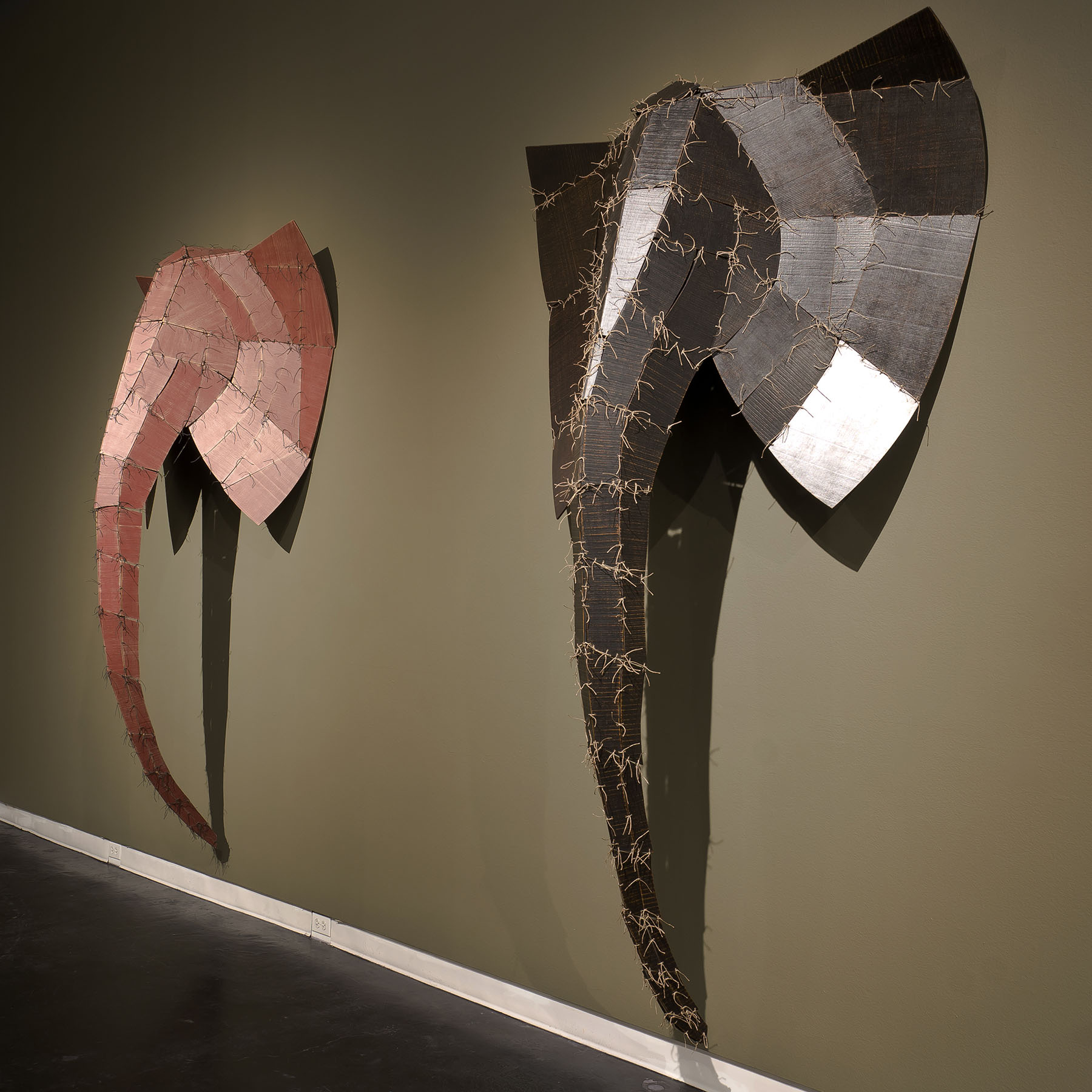 Wendy Maruyama, The WildLIFE Project: Sonje (left) (2013) and Lekuta (right) (2014)(Installation view). Wood, string, paint. Dimensions: Sonje 100” l x 50” w x 24”d; Lekuta 100” l x 50” w x 30” d. © Wendy Maruyama. Courtesy of the artist.