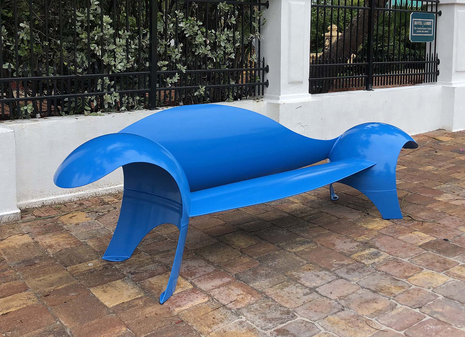 Colin Selig, Hemi Asymmetric Bench (2021). Outdoor metal seating crafted from repurposed scrap propane tank. Dimensions: 34” h x 120” w x 30” d with a 65” seat. ©Colin Selig 2021. Courtesy of the artist.