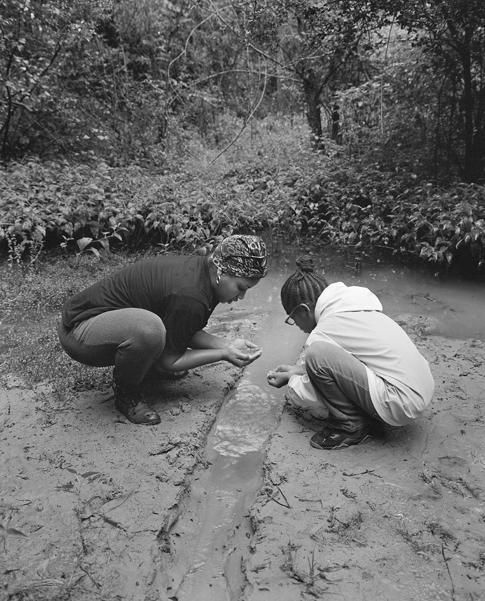 Shea and Her Daughter, Zion, Sipping Water from Their Freshwater Spring, Newton Mississippi, 2017-2019. ©2022 LaToya Ruby Frazier. Courtesy of the artist and Gladstone Gallery.